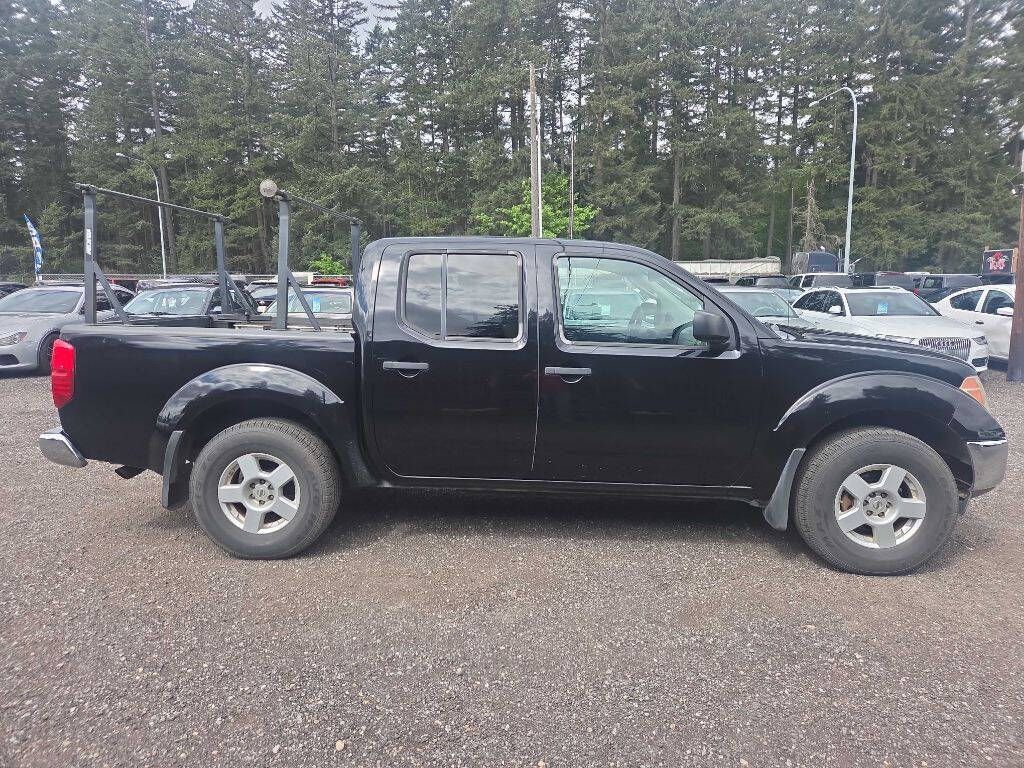 Black 2005 Nissan Frontier Pickup Truck Four-Wheel Drive 6-Speed Manual