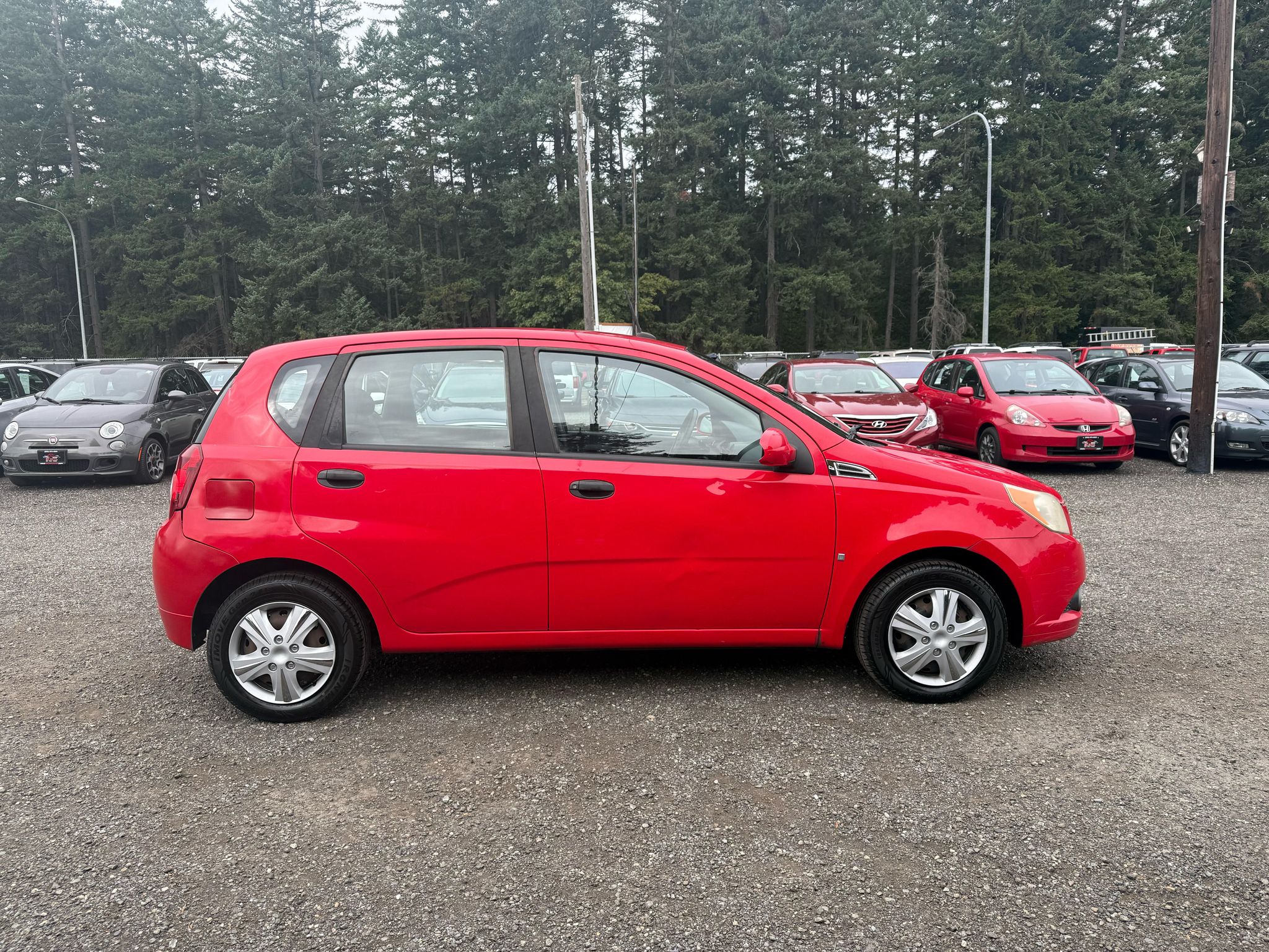 Red 2009 Chevrolet Aveo Hatchback Front-Wheel Drive Manual