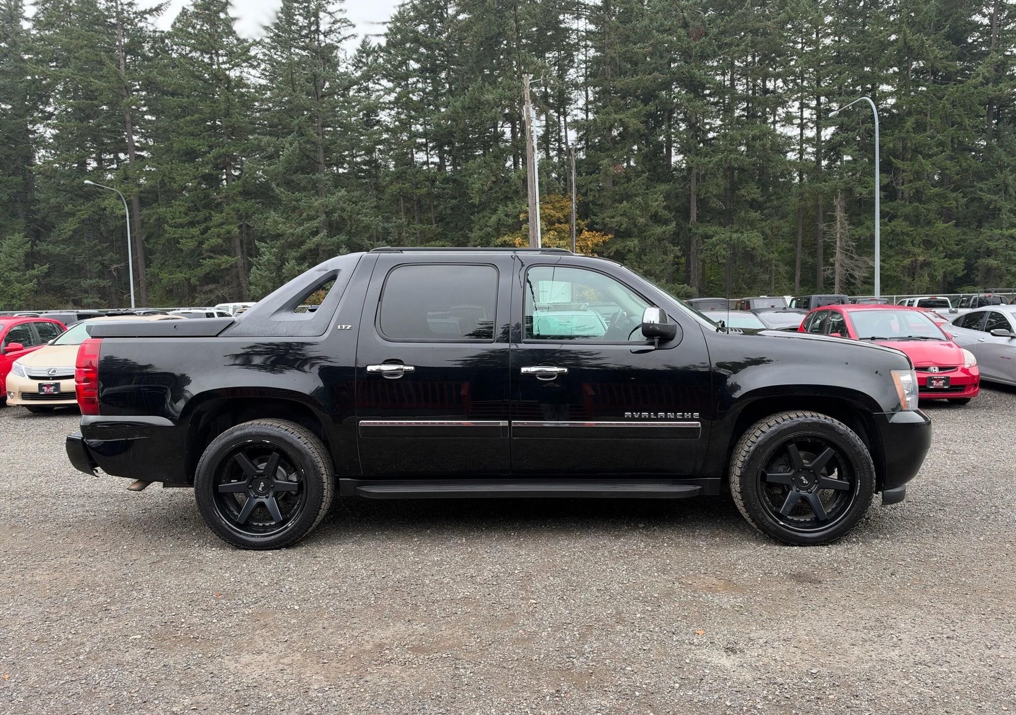 Black 2010 Chevrolet Avalanche Pickup Truck Four-Wheel Drive Automatic